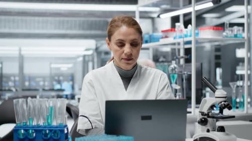 Female Scientist Working on Laptop in a Lab