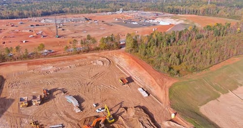 A Construction Site is Being Worked on with Heavy Construction Equipment