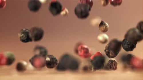Colorful Peppercorns Falling in Slow Motion