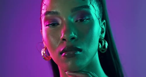 Neon lights, makeup and face of woman with glow in studio with beauty, creativity and vibrant color