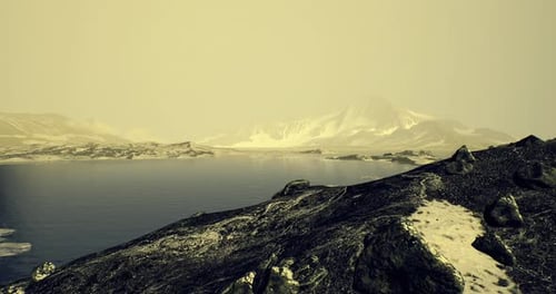 Majestic Mountain Landscape with Serene Water Body During Twilight Hours
