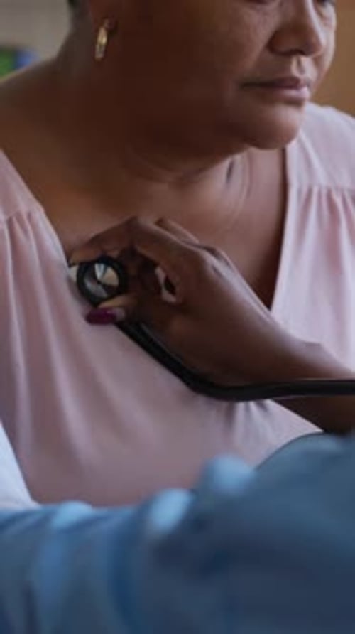 Home Health Care, Nurse Listening To Older Woman