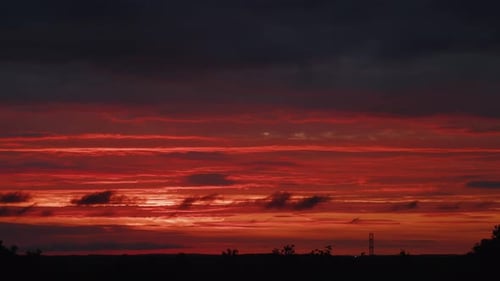 TimeLapse Of Big Sunrise With Red Sky And Clouds