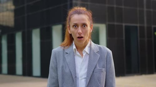 Woman Expressing Surprise Emotion in Urban Setting