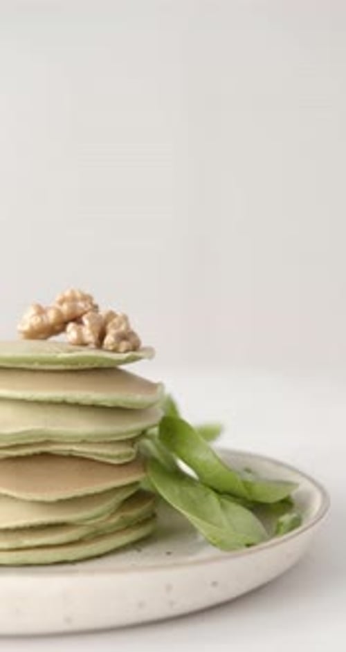 Appetizing Pancakes Stacked with Spinach and Walnuts
