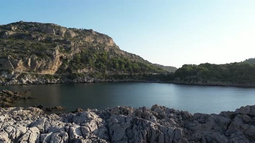Rocky Cove Meets the Blue Sea
