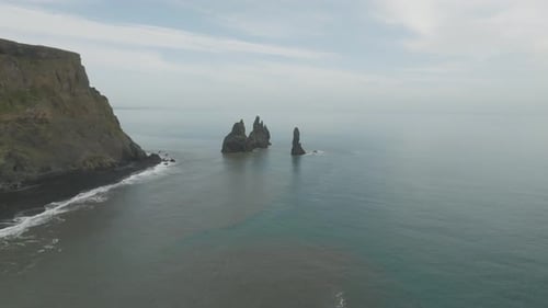 Aerial view of rock formation along the coastline in Iceland.