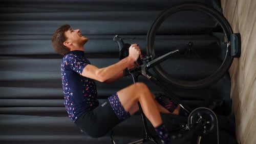 Man on Indoor Trainer Riding Road Bike