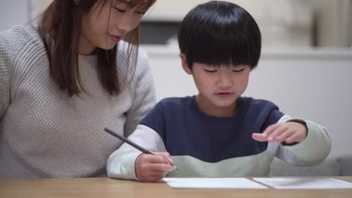 Parents and children practicing calligraphy