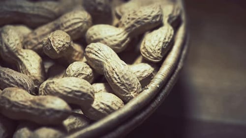 Peanuts in Shells in Woven Basket Close Up