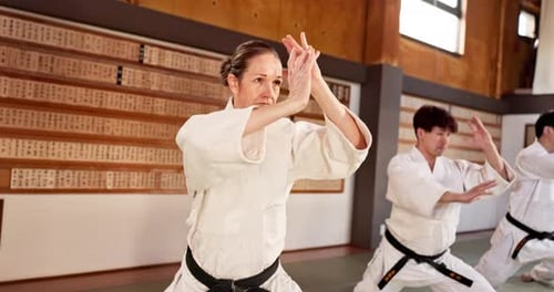 Small Group Practices Martial Arts Movements Indoors