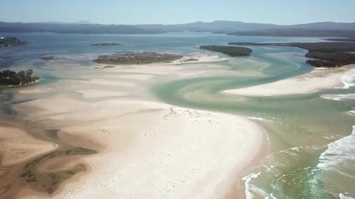 Aerial footage flying towards the mouth of the Wallagaraugh River at Mallacoota at low tide, eastern