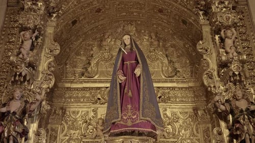 Ornate religious statue in a gilded altar