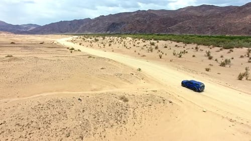 Travel, sand and desert with truck in dirt road of countryside for freedom