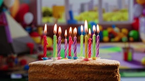 Woman Kid Child Blowing Candles on Birthday Cake Macro Close Up of Some Unlit Candles and Just One