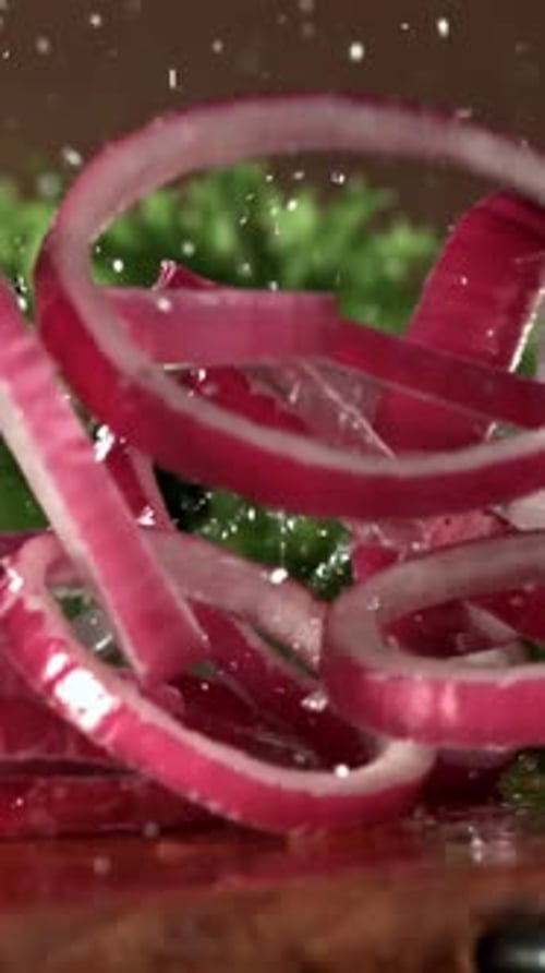 The Chopped Onion Falls Onto the Cutting Board Filmed on a Highspeed Camera at 1000 Fps