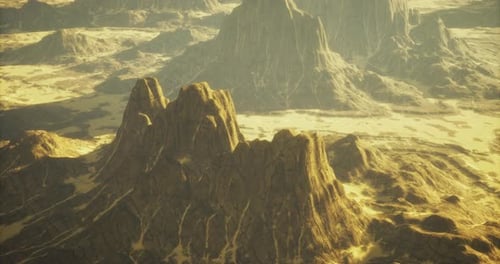 Majestic Rock Formations Under Golden Sunlight in a Vast Landscape
