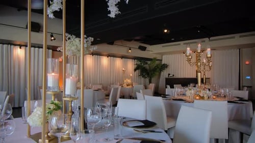 A Restaurant Filled with Tables and Chairs and Candles on Them Wedding Event