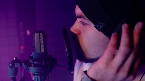 Rap Singer Recording New Track in Audio Studio