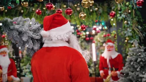 Santa Claus Carrying Snowy Christmas Tree Decoration