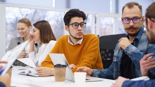 Group of Office Employees Sit and Discuss on Startup Project in Conference Room Team of Business