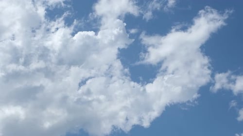 Clouds Moving Across a Blue Sky