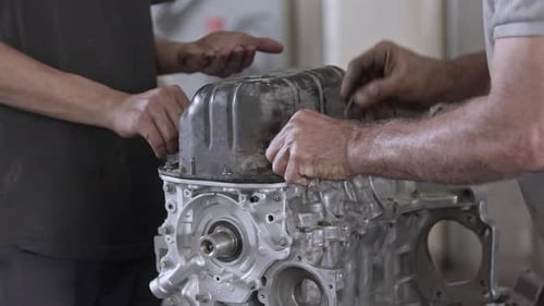 Installing Car Engine Crankcase Cover Screws In The Repair Shop 1