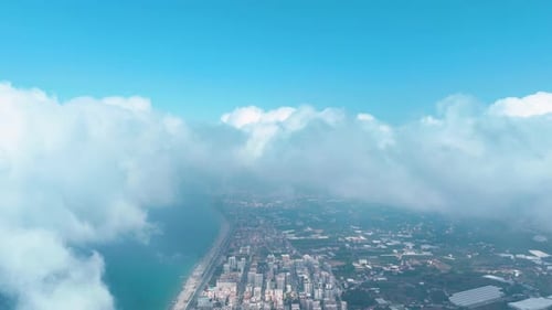 Aerial View FastMoving Clouds Over a Busy City