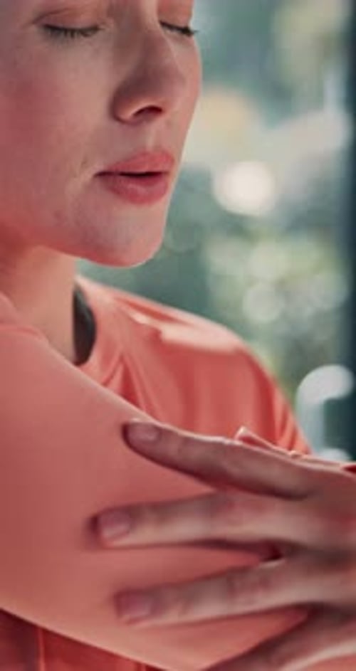 Woman Massaging Her Upper Body Indoors