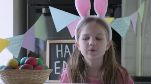 Funny Child Girl with Bunny Ears Play Easter Hunter at Home