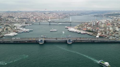 The Galata Bridge and the Golden Horn fly upward shot