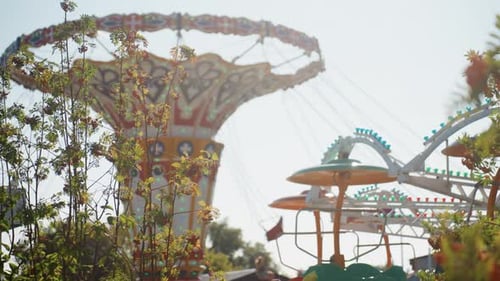 Colorful Swing Set in Sunlight Nostalgic Amusement Ride with Vibrant Surroundings Vintage Fairground