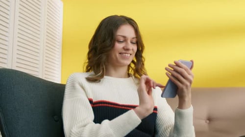 Girl Scrolling Smartphone Touchscreen with Finger Positive Student Having Break