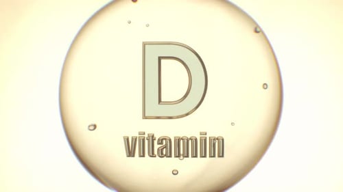 Golden Vitamin D Oil Drop - Health and Beauty Supplement Concept