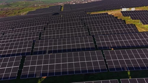 Solar panels cover a large field in a renewable energy project