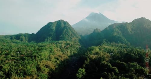 Merapi volcano with two hills in the foreground. aerial shot of mountain.