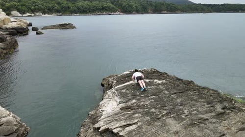 aerial man training on rock