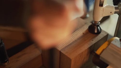 Close-Up Slow Motion Shot Drilling a Hole into Wood