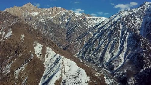 Snowy Mountain Range Aerial on Sunny Day