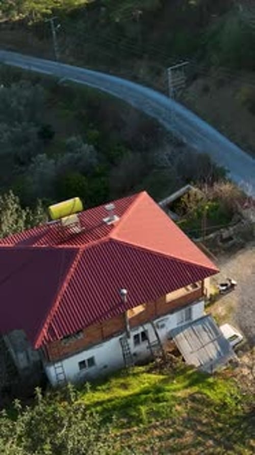 Vertical Video Aerial Perspective Rustic Farming Homes in a Mountain Village Oasis