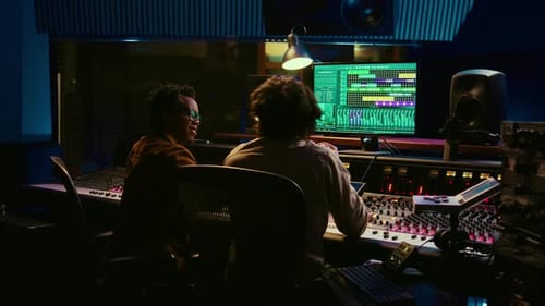 Diverse Team of Artist and Sound Designer Working on Editing Tunes for a New Hit