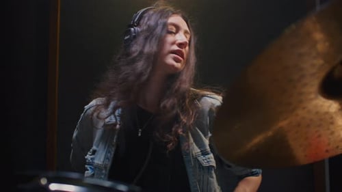 Woman Drummer Plays a Drum Kit Female Musician Beats a Rock Rhythm on Drums Girl Artist is