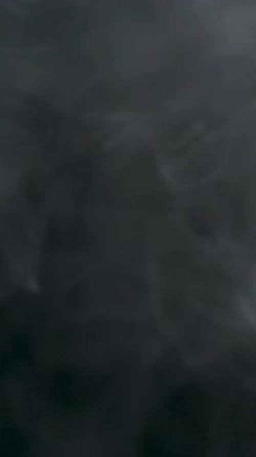 Ethereal White Smoke Swirling on a Dark Background