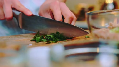Chopping Fresh Herbs in Kitchen for Salad