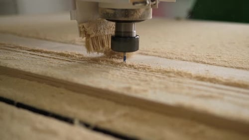 A Powerful Cutter for Wood Materials Works with Plywood in a Carpentry Workshop