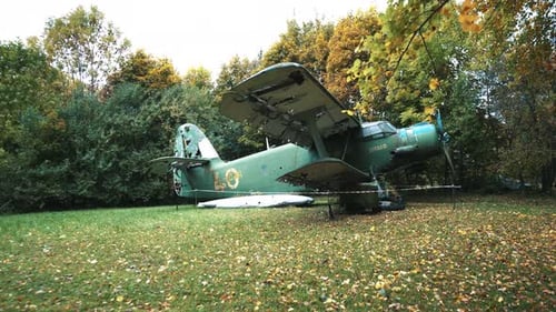 Dilapidated Biplane Aircraft in Autumnal Field