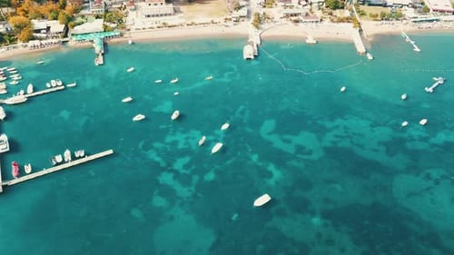 Aerial view of boeats near the Budva city coast beach. Drone footage