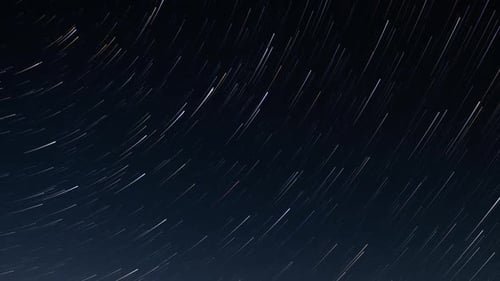 Time Lapse of Star Trails in Dark Night Sky