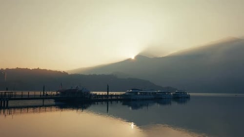 The early morning sunrise enveloped the lake and mountains.