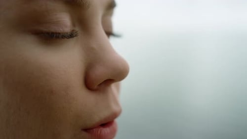 Portrait of Relaxed Woman Breathing Deeply Doing Yoga Exercise Outside. Close Up